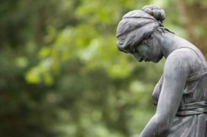 embracing grief sad statue